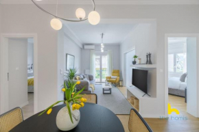 Sun-Splashed 2-BDR Corner Apartment with Hillside views!
